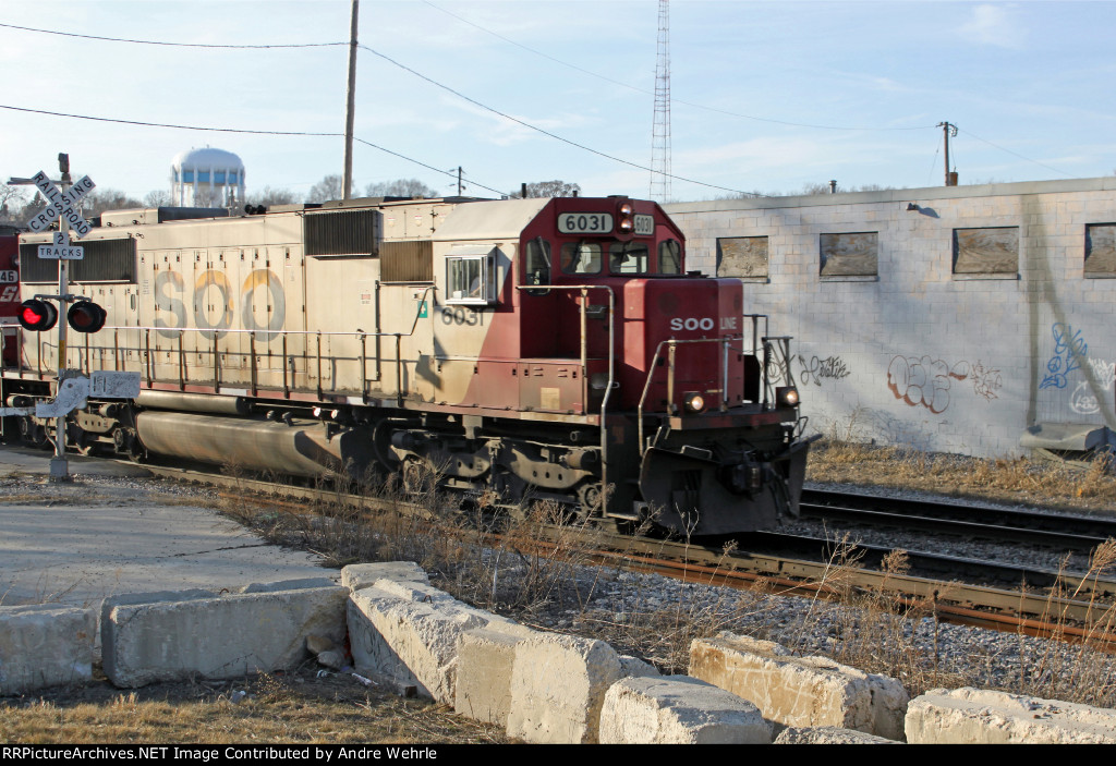 SOO 6031 leads 282 out of the late afternoon sun